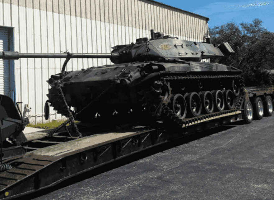 military tow with lowboy truck