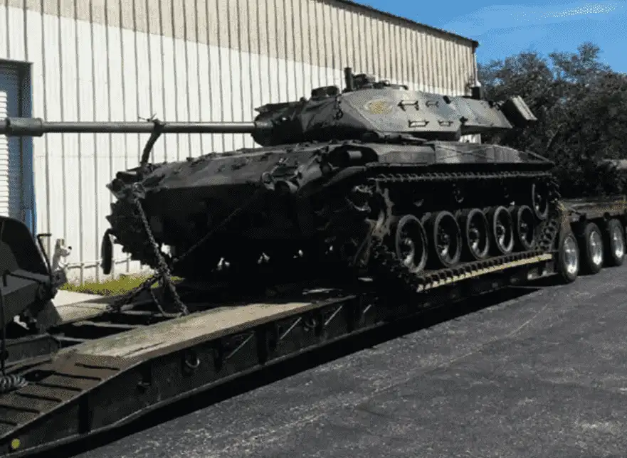 military tow with lowboy truck