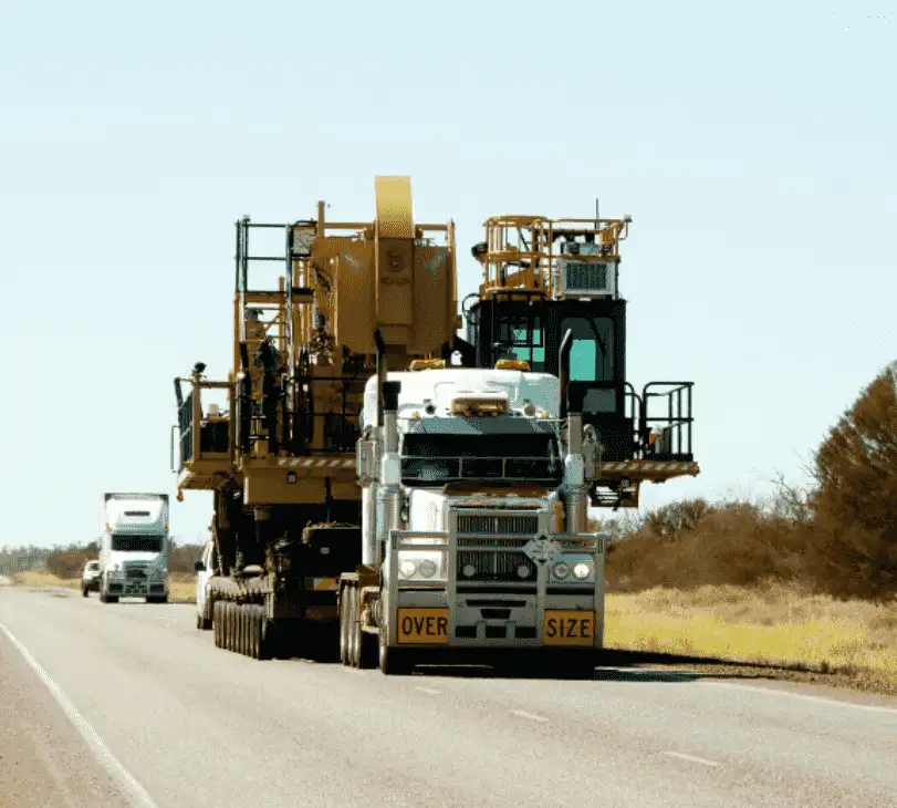 Oversized Load Hauling with Lowboy Trucks Large, heavy items like industrial machinery and construction equipment