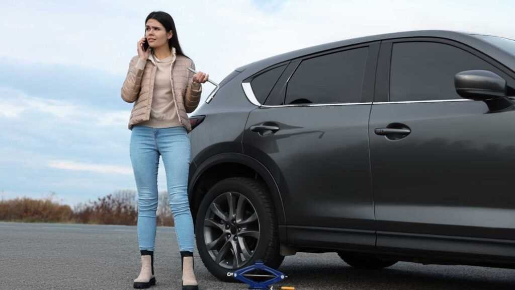 woman waiting for tyre change
